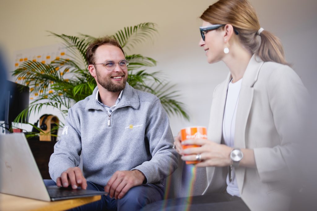 FirstAttribute colleagues in conversation FirstAttribute colleagues in conversation